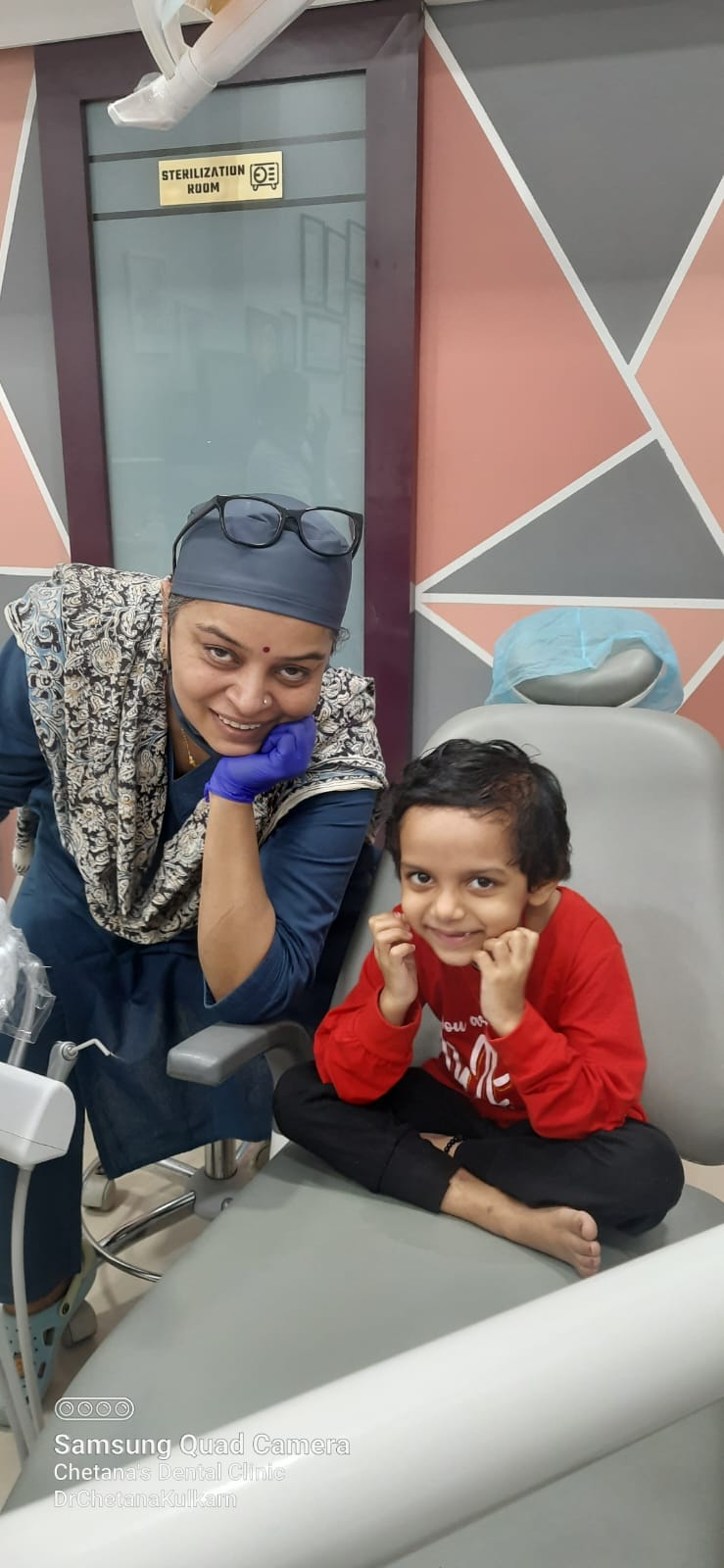 Dentist explaining a dental X-ray to a patient